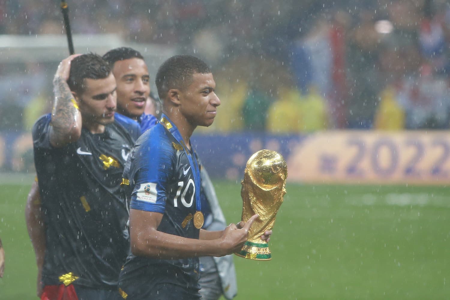 Kylian Mbappé with the 2018 Soccer World Cup trophy