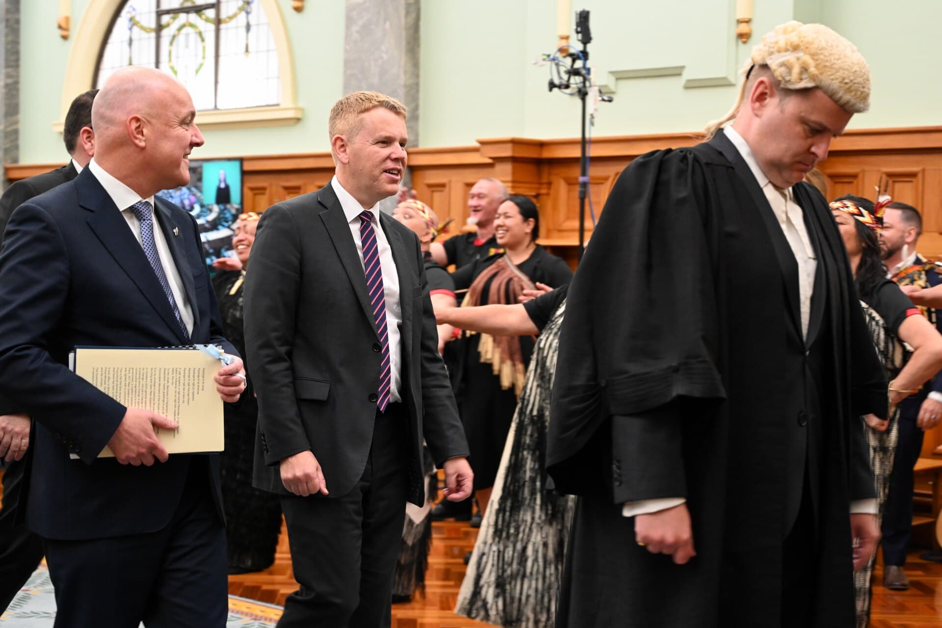 Christopher Luxon and Chris Hipkins 2023 - State Opening of the 54th Parliament, on 6 December 2023. They are led by the clerk-assistant of the Office of the Clerk of the House of Representatives, James Picker.